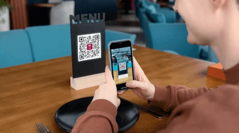 Visual représentant le code QR de numérisation des clients dans un restaurant